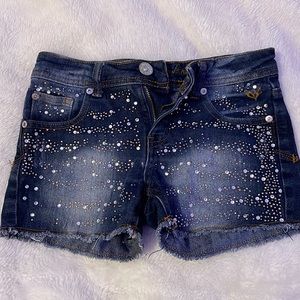 these jean shorts are super cute that have jems. size 12 in kids.